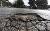 buche-in-strada-causate-pioggia-roma-corruzione-appalti-manutenzione-stradale-1.jpg