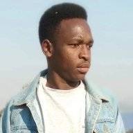 enos_komanya